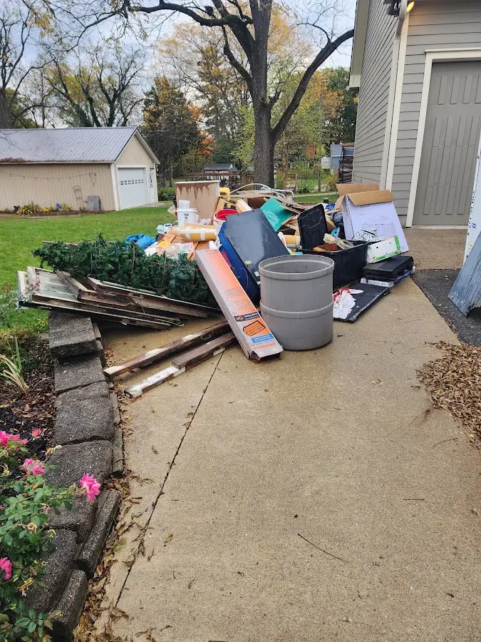 Dumpster being loaded with debris for 3 Yard Dumpster Rental in Delavan